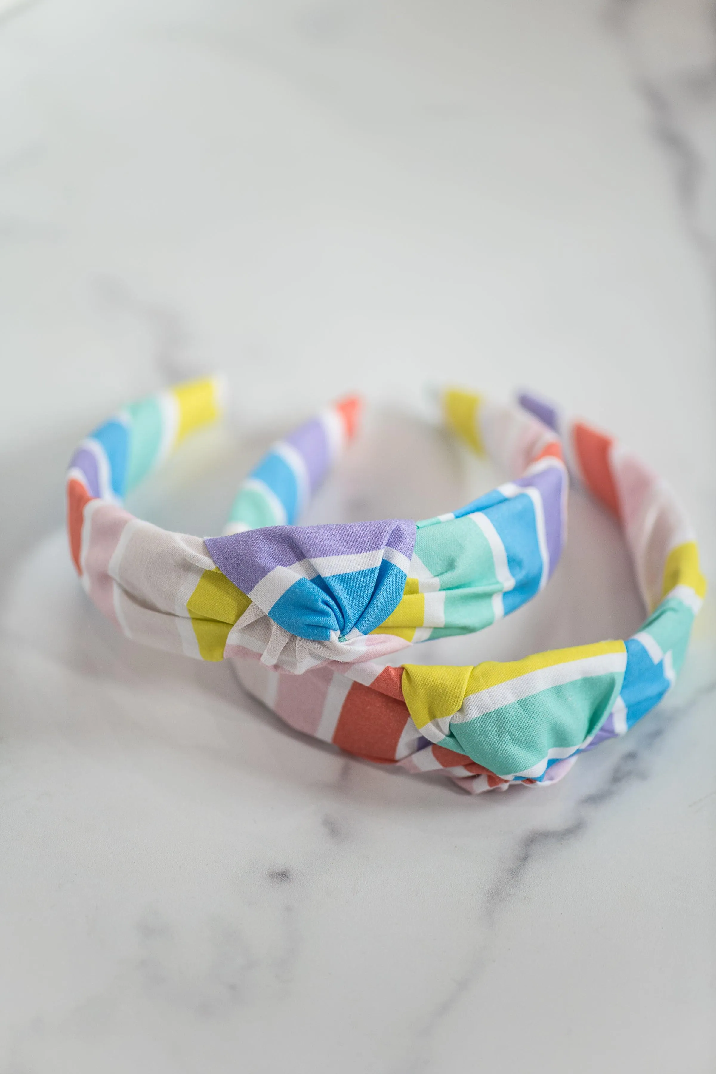 The Tiny Tassel Headband in Rainbow Striped Brights